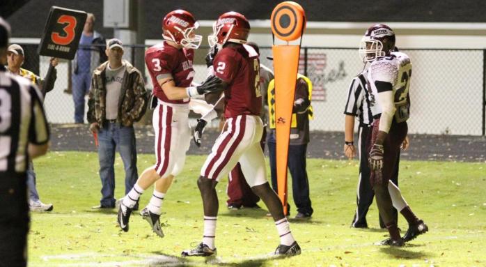 Bulldog freshman receiver Daniel Huffines, left, congratulates Jonathan Rumph on a first half touchdown against Hinds Community College.
